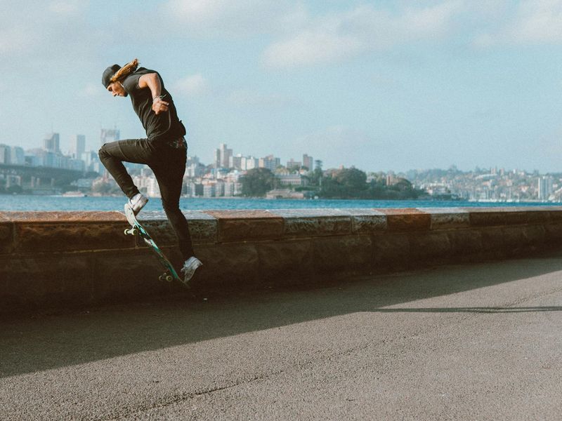 A person in mid-motion during a fluid exercise, showing control and focus.
